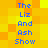 Pixelated text "The Liz And Ash Show" repeated in two vertical on a yellow-orange gradient background with blue lettering