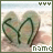 A heart-shaped sand drawing with green lines on a beach background, showing sequential animation frames of the right side's line shifting leftward.
