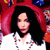 Pixelated image of a person with long dark hair wearing a white top, set against a red and blue background with partial figures visible.