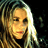 Pixelated image of a person with long light brown hair against dark background, next to text reading Charlotte Martin dancing on needles on tour.