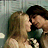 A 48x48 pixel animated buddy icon featuring a close-up of two people in an intimate pose with text overlay on the right side.