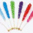 Animated sequence showing a fan of colored lollipops, a heart-shaped candy cluster on pink background, and scattered colorful candies.