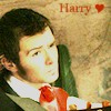 A static image of a person with dark hair wearing a white shirt and red cravat, with the text 'Harry' and a red heart symbol in the top-right corner.