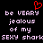 Red heart symbol above pixelated text reading 'be VEARY jealous of my SEXY shark' on black background.