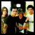 Four people pose together in a group photo next to bold text reading FALL OUT BOY on the right side.