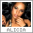 Pixelated image of a person with light skin tone, dark hair, and a neutral expression, with text 'ALICIA' below.