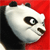 Pixelated panda head with black ears and eye patches, white face, brown nose, and red background, viewed from left side.