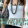 A person wearing a white tank top, dark pants, and multiple beaded necklaces with black, turquoise, and purple beads, holding a black and white patterned handbag.