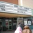 Static image of a pixelated building facade with visible text and architectural details.