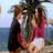 Animated sequence showing two people embracing on a balcony with ocean view, transitioning from standing to seated pose.