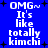 Blue background with white pixelated text reading "OMG~ It's like totally kimchi" repeated in two vertical , surrounded by black plus signs