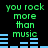 Green pixelated text reads "you rock more than music" above blue audio waveforms on a black background, with two identical static frames displayed side-by-side.