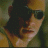 A person with dark hair and sunglasses wears a sleeveless top, shown in four where the right is blank