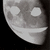 A grayscale animated icon shows a stylized face with two circular eyes and a wide curved mouth, shifting slightly between frames.