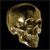 Pixelated golden skull with reflective eye sockets against a black background, viewed from a three-quarter angle showing the right side of the skull.