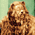 Pixelated image of a light brown dog with darker brown patches, standing against a green background.