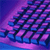 Pixelated abstract composition of dark blue and purple shapes against a gradient background transitioning from deep blue to magenta.