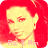 Pixelated image of a person with red hair and yellow skin tones, wearing a yellow top with text at the bottom.
