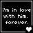 Four black square with white pixelated text 'i'm in love with him. forever.' and heart symbols changing from solid to empty across frames