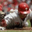 Pixelated image of a baseball player in white uniform with red helmet sliding into base, split into four quadrants with blue and gray text