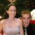 A pixelated image shows a woman in a white dress and a man in dark clothing standing close together, with colorful heart-shaped icons on the right side.