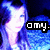 Pixelated image of a person with light hair against blue and purple background, featuring black text box reading 'omy.' in white letters.