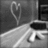 Black-and-white animated icon with heart-shaped light trails and text reading "I Love Brian" over a blurred background.