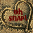 Two identical circular stone-like frames with textured brown and beige backgrounds, each containing red pixelated text.