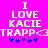 Pixelated text on bright pink background with blue star symbols below, showing 'I LOVE KACIE TRAPP<3' in white block letters.