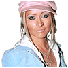 A static image shows a person in a light blue jacket and pink headband on the left, with large black letters T, N, I, A arranged below and to the right of a pink circle containing an X.