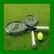 Green tennis racket and ball on grass with pixelated text reading 'tennis is sweet' in green letters.