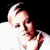 Pixelated image of a person with light hair in white clothing against black background, next to green text reading 'Original Icons .com' on solid dark green backdrop.