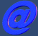 Animated sequence of a blue @ symbol rotating through multiple angles against dark backgrounds, showing front, side, and back views with color variations.