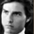 Static grayscale buddy icon showing a pixelated close-up of a person's face with visible facial features and dark hair against a black background.