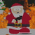 Santa Claus in red suit with black belt and white trim stands before orange flames, holding a dark object near his chest.