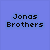 Pixelated image of three men in dark clothing with one wearing a pink shirt, overlaid with blue text reading 'Jonas Brothers' and '8.7.08 cant wait!' on a light gray background.