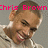 Pixelated image of a person with short brown hair and a light-colored shirt, overlaid with bright pink text reading 'Chris Brown' across the top.