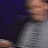 A pixelated image shows a person in motion with visible hands and clothing, alongside repeated text elements on a dark background.
