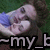 Pixelated image of a person with light skin and dark hair lying on grass, wearing blue clothing, with partial text reading "-my_b" at the bottom.