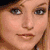 Two side-by-side pixelated portraits of women with distinct facial features and expressions, below a blue starburst background with text.