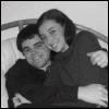 A six- shows a black-and-white photo of two people embracing, with pink lip prints and text appearing