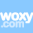 Static pixel art of white text 'WOXY.com' on a light blue background with visible dithering and blocky rendering.
