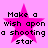 A static image with a pink background featuring four identical pixelated text blocks arranged in a , each containing the phrase "Make a wish upon a shooting star" overlaid on a bright pink star shape