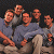 A 50x50 pixel animated contact sheet showing two frames of a group of people on the left and green text reading "Original Icons .com" on the right against a dark background.