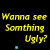 Yellow text "Wanna see Somthing Ugly?" and green text "Go Look In a mirror!" repeated in on black background with small blue dots