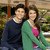 A pixelated image of two people sitting together, with text overlay appearing in the top-right corner.