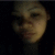 A person with dark hair and light skin appears in a of four , each showing slight variations in facial expression and head position against a dark background