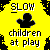 Yellow 'SLOW children at play' sign with black silhouette, orange figures on gray and black platforms, speech bubbles reading 'I'LL', 'GET', 'YOU'.