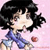 Pixelated character with black hair and blue clothing against a pink background, holding a small red object.