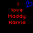 Pixelated red text 'i love Maddy Harris' on black background with blue heart symbol above 'i'
